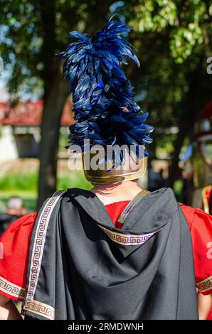 roman centurion with his back turned at a historical reenactment party Stock Photo