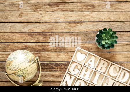 A set of wooden letters in a wooden box, top view. Stock Photo