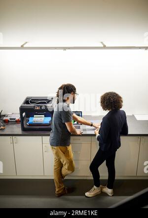 High angle view of colleagues working in office Stock Photo