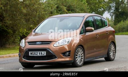 Whittlebury,Northants,UK -Aug 26th 2023: 2013 diesel engine Ford C-Max car travelling on an English country road Stock Photo