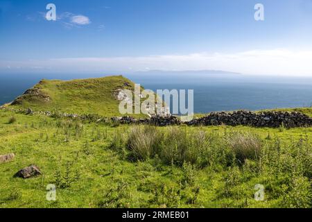 Murlough Road, going to Murlough Bay with Mull of Kintyre on horizon, Northern Ireland, UK Stock Photo