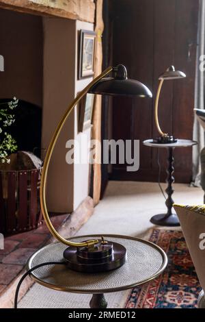 Pair of vintage lamps on side tables in Tudor farmhouse, Surrey, UK Stock Photo