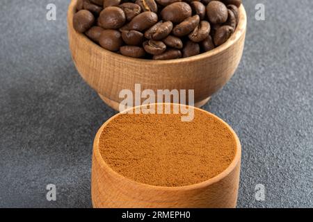 Coffee beans with a bowl of ground coffee ,closeup Stock Photo