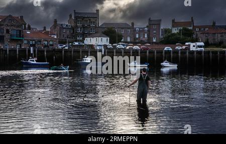 Traditional salmon fishermen fishing at the mouth of the River Tweed, Berwick upon Tweed, Northumberland, England, UK Stock Photo