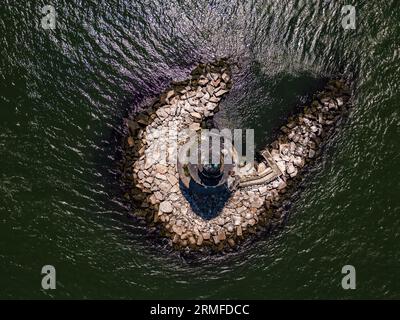 Aerial view of Orient Point Lighthouse on Long Island, New York, illuminated in the bright sunlight Stock Photo