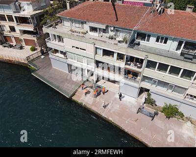 window installation company installs windows using a crane. captured by a drone Stock Photo