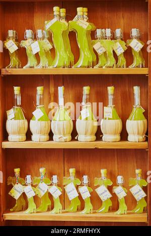 Many bottles of traditional Italian alcoholic beverage - Limoncello Stock Photo