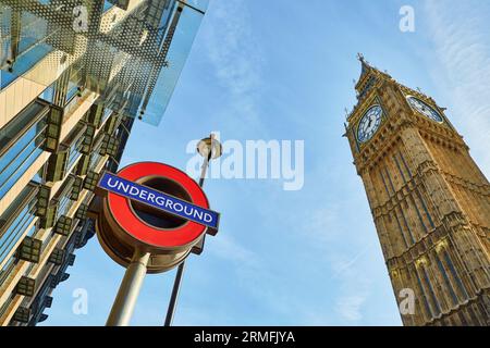 LONDON, UK - OCTOBER 31, 2014: London Underground subway sign in front of famous Clock Tower (now officially called the Elizabeth Tower) with bell Big Stock Photo