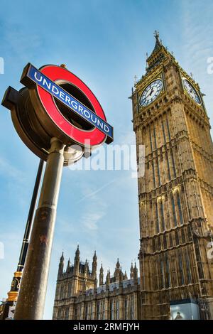 LONDON, UK - OCTOBER 31, 2014: London Underground subway sign in front of famous Clock Tower (now officially called the Elizabeth Tower) with bell Big Stock Photo