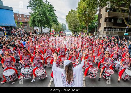 London, UK. 28th Aug, 2023. The Batala Brazil drum band celebrate their 25th year - The Monday of the Notting Hill Carnival, traditionally the main paradeday. The annual event on the streets of the Royal Borough of Kensington and Chelsea, over the August bank holiday weekend. It is led by members of the British West Indian community, and attracts around one million people annually, making it one of the world's largest street festivals. Credit: Guy Bell/Alamy Live News Stock Photo