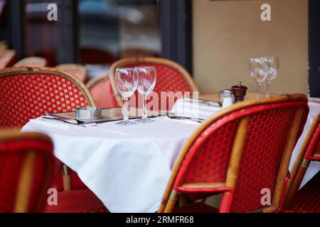 Tables of cozy outdoor cafe in Paris, France Stock Photo