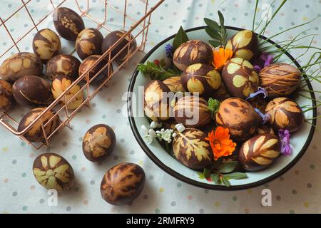 Preparation of eggs for Easter, dyeing is done with natural ingredients found in grasses and herbs Stock Photo