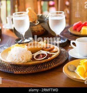 Traditional Philippino breakfast with garlic rice and adobo Stock Photo
