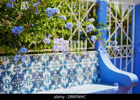 Bench decorated with azulejos, traditional Portuguese tilework, in a typical village of Portugal Stock Photo
