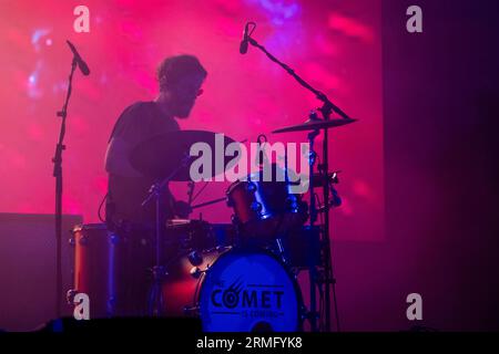 The Comet Is Coming play during a massive rainstorm on the Mountain Stage at Green Man Festival in Wales, UK, August 2023. Photo: Rob Watkins Stock Photo