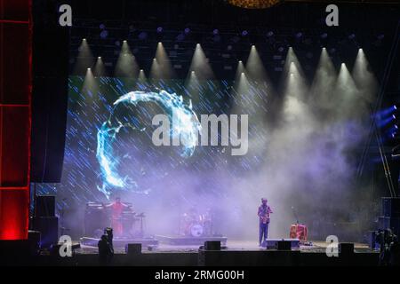 The Comet Is Coming play during a massive rainstorm on the Mountain Stage at Green Man Festival in Wales, UK, August 2023. Photo: Rob Watkins Stock Photo