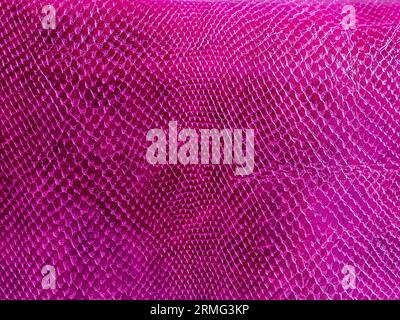 Abstract texture of imitation crocodile skin top view. Pink vertical  texture background. Reptile shiny textile, fabric design. Pink patent  bright croc Stock Photo - Alamy