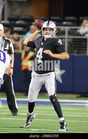 Las Vegas Raiders quarterback Aidan O'Connell (4) gestures as he warms up  before the first half of a preseason NFL football game against the Dallas  Cowboys in Arlington, Texas, Saturday, Aug. 26