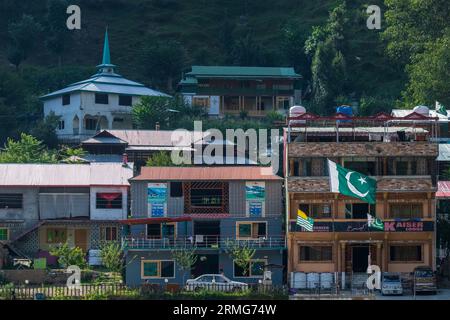 Keran Kupwara, India. 24th Aug, 2023. General view of hotels in Pakistan administered Kashmir on the banks of Neelam river or Kishan Ganga that has divided Kashmir into two parts controlled by nuclear rivals India and Pakistan. The river acts as a disputed line of control and flows through a village called Keran from both sides which is located on the northern side of Indian Kashmir's Border district Kupwara some 150kms from Srinagar and 93kms from Muzaffarabad, in the Pakistan side of Kashmir. (Photo by Faisal Bashir/SOPA Images/Sipa USA) Credit: Sipa USA/Alamy Live News Stock Photo