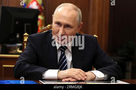Moscow, Russia. 28th Aug, 2023. Russian President Vladimir Putin listens to Omsk Region Acting Governor Vitaly Khotsenko during a face-to-face meeting at the Kremlin, August 28, 2023 in Moscow, Russia. Credit: Mikhail Klimentyev/Kremlin Pool/Alamy Live News Stock Photo