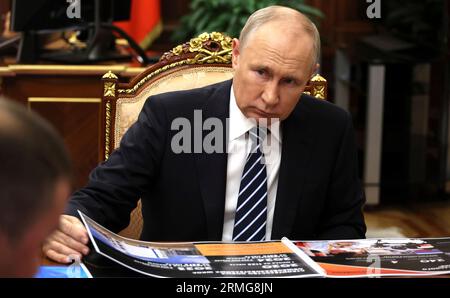 Moscow, Russia. 28th Aug, 2023. Russian President Vladimir Putin listens to Omsk Region Acting Governor Vitaly Khotsenko during a face-to-face meeting at the Kremlin, August 28, 2023 in Moscow, Russia. Credit: Mikhail Klimentyev/Kremlin Pool/Alamy Live News Stock Photo