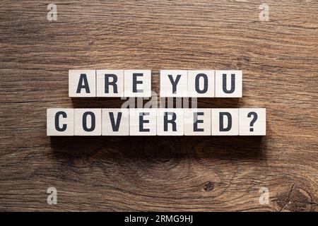 Are you covered - word concept on building blocks, text Stock Photo