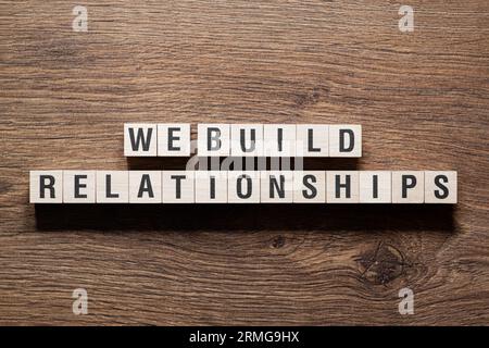 We build relationships - word concept on building blocks, text Stock Photo