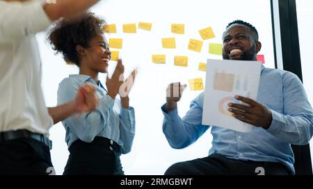 Happy business employees officer team celebrating success in meeting room Stock Photo