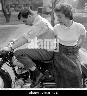 In the 1950s. A man on his Puch motorcycle with a woman sitting behind him. Sweden 1955. Stock Photo