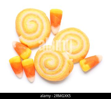 Tasty cookies with candy corns for Halloween celebration isolated on white background Stock Photo