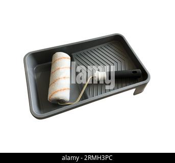 Paint roller in empty tray working tools isolated with clipping path object for making repair works Stock Photo