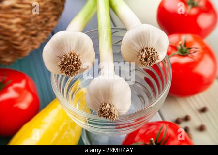 young garlic on wood background Stock Photo