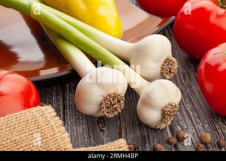 young garlic on wood background Stock Photo