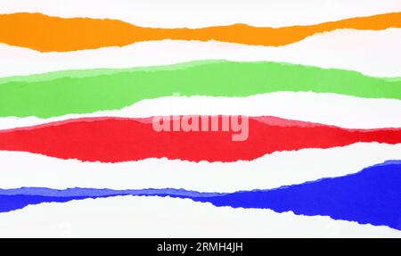 Torn orange, green, red and blue papers background Stock Photo
