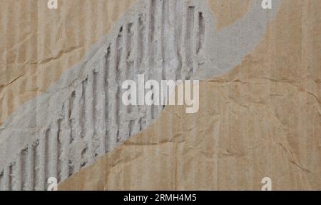 Close-up of brown ripped cardboard texture Stock Photo