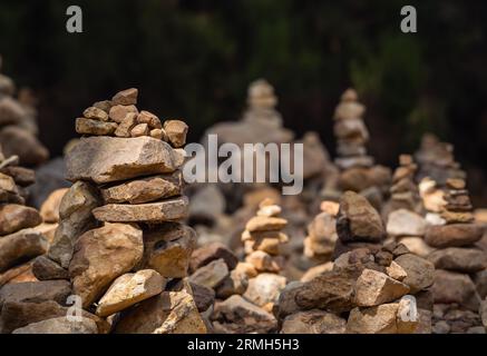 A close-up of the small pyramids made of stones in the park. Abstract Rustler canyon moher cliffs landscape. Provencal Colorado near Roussillon Stock Photo