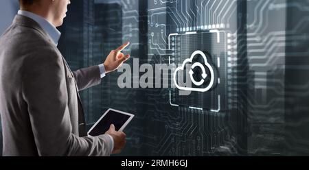 Cloud computing concept. Businessman clicking on virtual screen. Connect to cloud. Cloud computing icon. Stock Photo