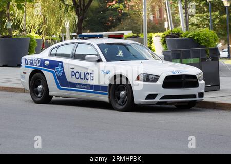 Montreal city police car parked curbside. Montreal,Quebec,Canada Stock Photo