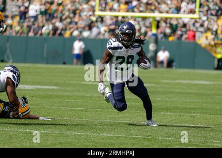 Seattle Seahawks running back SaRodorick Thompson Jr. (29) is tackled by  Green Bay Packers cornerback Shemar Jean-Charles (22) in the second half of  a preseason NFL football game, Saturday, Aug. 26, 2023