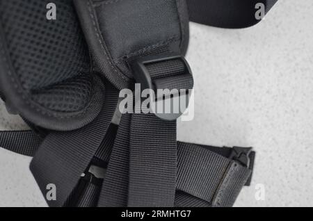 Black suspender or belt close-up, elegant and high-quality accessory to complete your style. Concept for backpacks or military accessories. Stock Photo