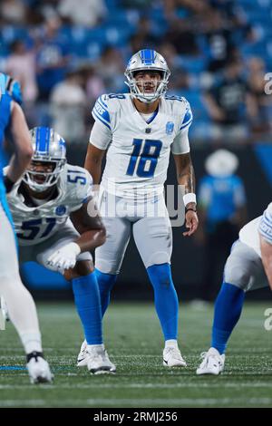 Detroit Lions quarterback Adrian Martinez 18 looks over the