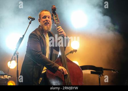 Portsmouth, UK. 27th Aug, 2023. Ted Dwane, vocalist, bass guitarist, and double bass player with British folk rock band, Mumford & Sons performing live on stage at Victorious Festival Credit: SOPA Images Limited/Alamy Live News Stock Photo