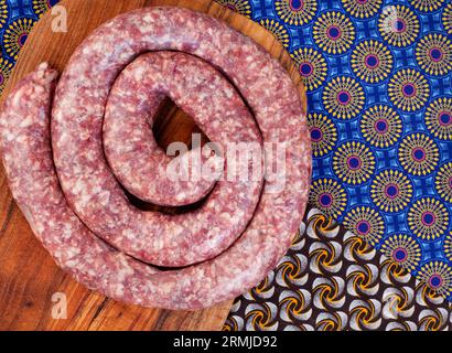 Traditional South African wors or sausage with iconic African printed fabric Stock Photo