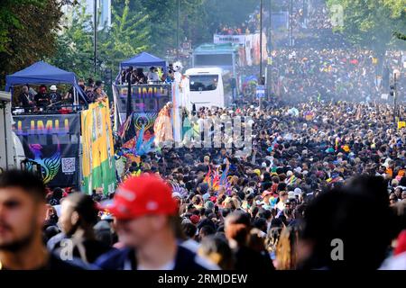 London, UK. Crowds of revellers in Ladbroke Grove as Notting Hill Carnival is in full swing on Bank Holiday Monday Stock Photo