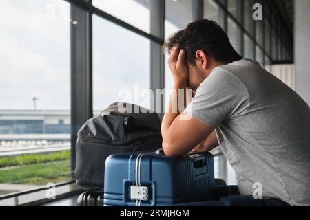 Man crying at the airport, frustrated because his flight was canceled ...