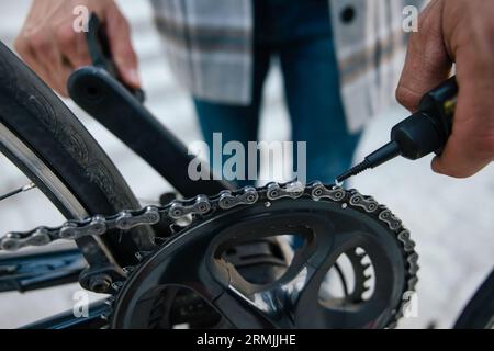 Close up of mans hands repairing a bike Stock Photo