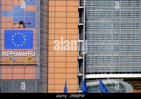 Belgium, Brussels: police drone in the sky flying over the European Commission Headquarters, the Berlaymont building Stock Photo