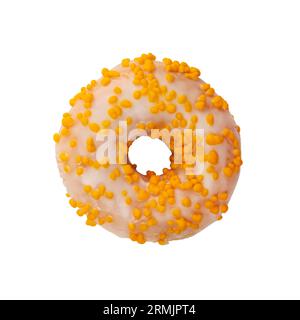 Fruit donut decorated with yellow sprinkles isolated on white background. Top view of Sweet treat with hole in the middle set against blank canvas. Stock Photo