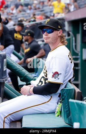 Pittsburgh Pirates center fielder Jack Suwinski looks out of the dugout  before the start of a baseball game against the Miami Marlins, Friday, June  23, 2023, in Miami. (AP Photo/Wilfredo Lee Stock