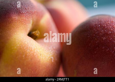 Extreme close up of three peaches Stock Photo